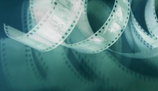retro film, 35mm film, perforated, negative on pink background, with shadow, photo film, vintage film, film photography, analog film, vintage photography, retro photo