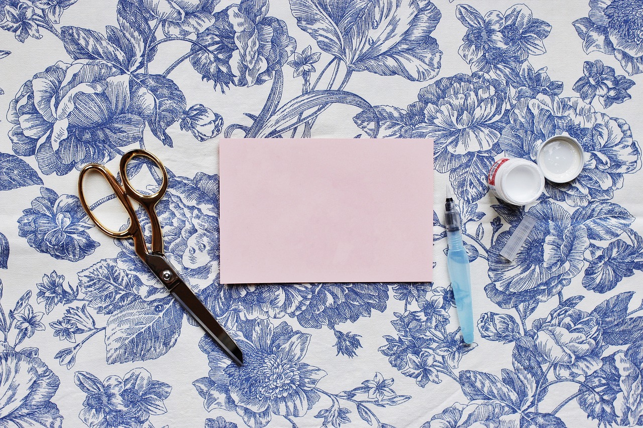 table, paper, envelope, scissors, paste, glue, blue paper, blue table, envelope, envelope, envelope, envelope, scissors, scissors, glue, glue, glue, glue, glue